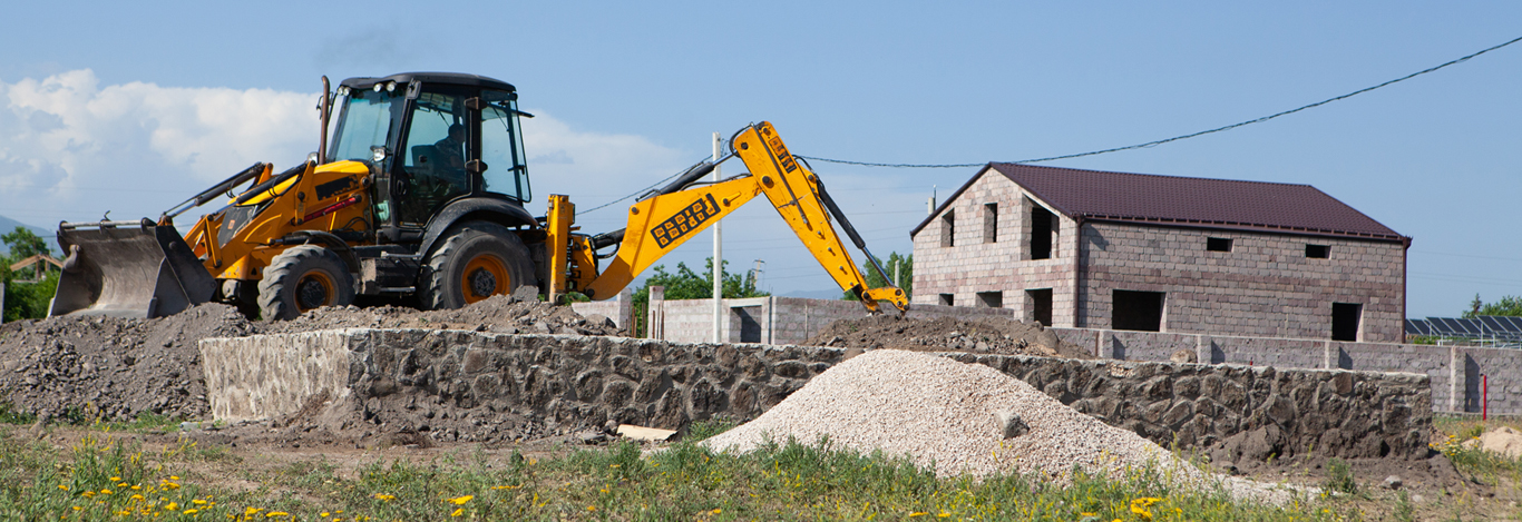 Excavator at work clearing land